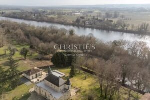Exquisite "Folie" featuring a Heated Pool and Hobby Golf Course on the Banks of the River