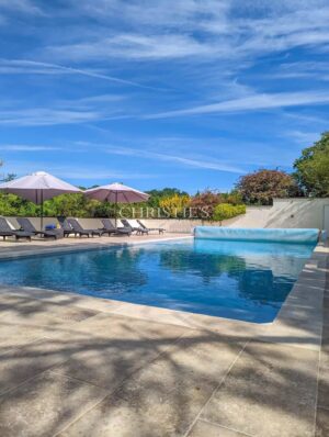 Stunning country manor house featuring beautiful gardens, a heated pool, and breathtaking views