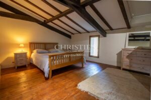 Stunning country manor house featuring beautiful gardens, a heated pool, and breathtaking views