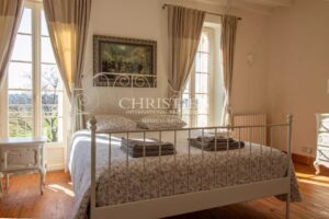 Stunning country manor house featuring beautiful gardens, a heated pool, and breathtaking views