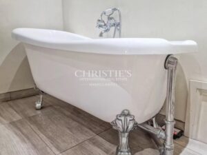 Stunning country manor house featuring beautiful gardens, a heated pool, and breathtaking views