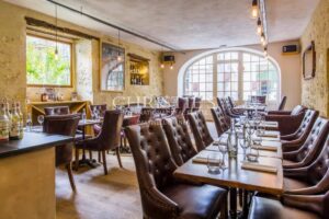 Large stone property with potential for a variety of uses in a private but central location in a lively Gascon town