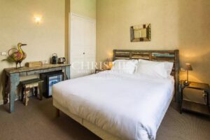 Large stone property with potential for a variety of uses in a private but central location in a lively Gascon town