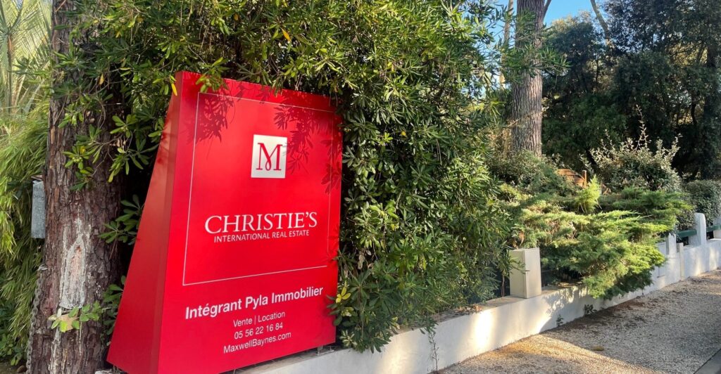Sign for ‘Pyla Immobilier’ and Christie’s