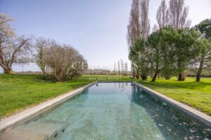 Enchanting Farmhouse with Unique Design Features and Attached Apartment on 4 Hectares of Parkland