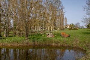 Enchanting Farmhouse with Unique Design Features and Attached Apartment on 4 Hectares of Parkland