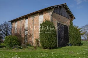 Enchanting Farmhouse with Unique Design Features and Attached Apartment on 4 Hectares of Parkland
